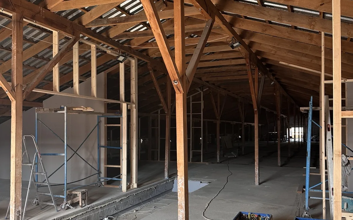 The floor today: framed rooms, scaffolding and tools in use